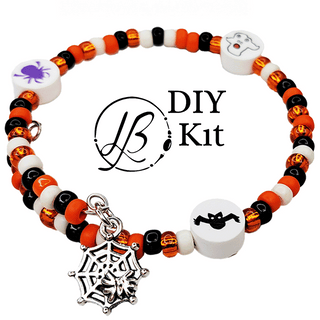 orange and black bracelet with charms on white background