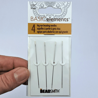 big eye needles in a 4-pack held by a hand against a white background