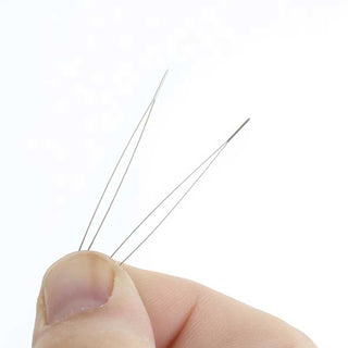 Large Eye Needles close up in a person's hand
