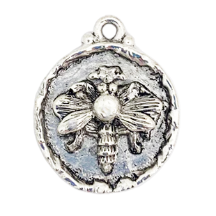 Silver plated pendant with raised bee in center.
