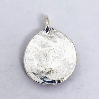 Back of a teardrop silver plated charm.
