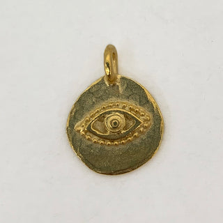 Satin gold plated round charm with an embossed eye.