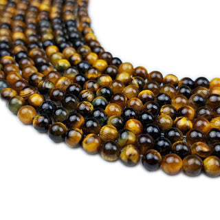 Strands of 4mm round Tiger Eye beads.