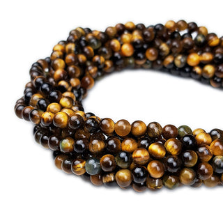 Strands of 4mm round Tiger Eye beads.