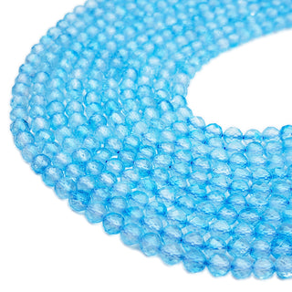 Strands of 5mm faceted round Apatite beads.