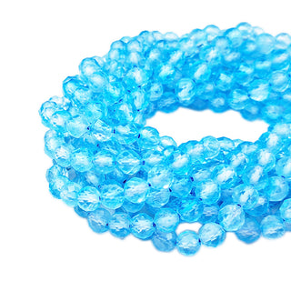 Strands of 5mm faceted round Apatite beads.