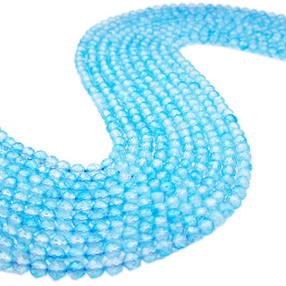 Strands of 5mm faceted round Apatite beads.