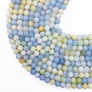 Strands of 6mm round Aquamarine beads.