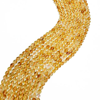 Strands of 6mm round Citrine.