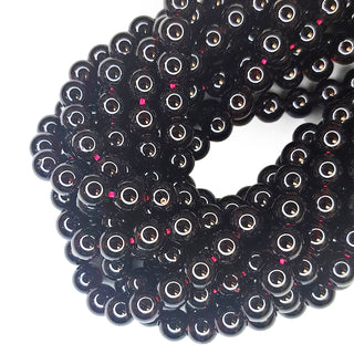 Strands of Round 6mm red garnet beads.