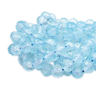 Strands of 7mm round faceted Topaz beads.