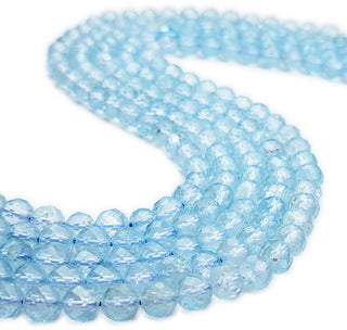 Strands of 7mm round faceted Topaz beads.