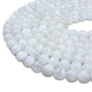 Strands of 8.5mm round Selenite beads.