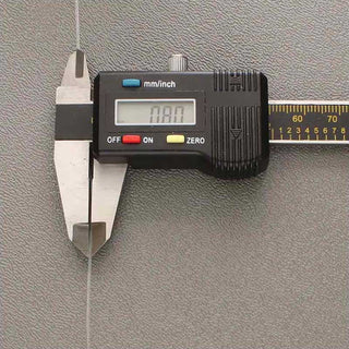 Stretch Magic Elastic Cord in size .8mm inn a digital caliper