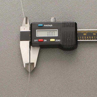 Stretch Magic Elastic Cord, size 1mm, in a digital caliper