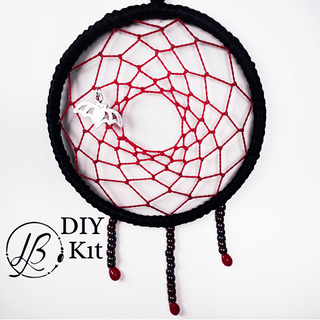 red and black dreamcatcher on white background