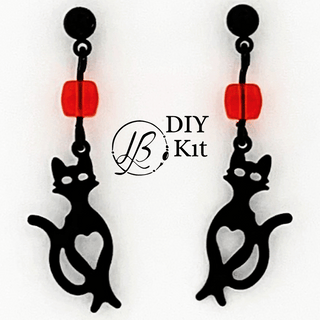 black and orange cat earrings on white background