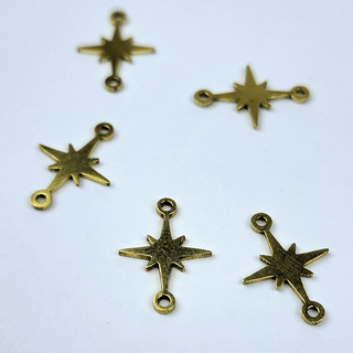 gold north star charms on white