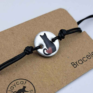 close up of Black Cat with Heart design black leather bracelet