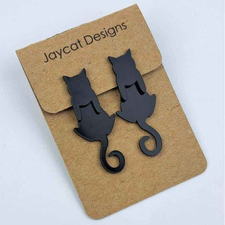 black cat earrings jacket style earrings on a brown paper jewelry card