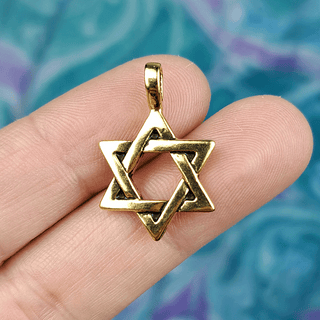 star of david charm on fingers