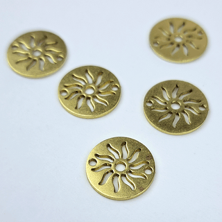 gold sun charms on white
